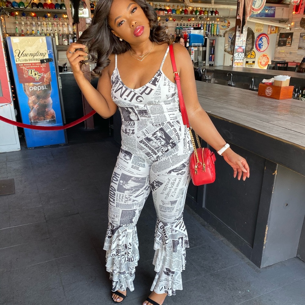 Ruffled jumpsuit newspaper print